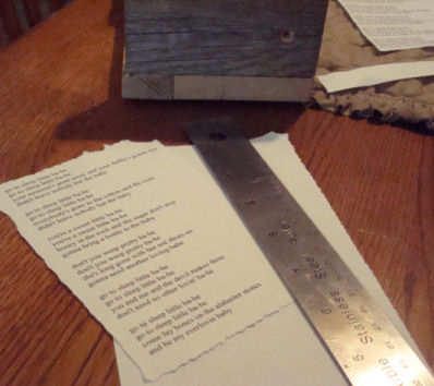 printed out the lyrics and used a ruler to tear around the edges. It 